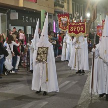 Penitents with white cloaks and hoods